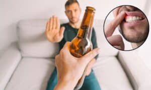 Man refusing beer bottle, with inset showing gum disease symptoms and tooth decay concerns.