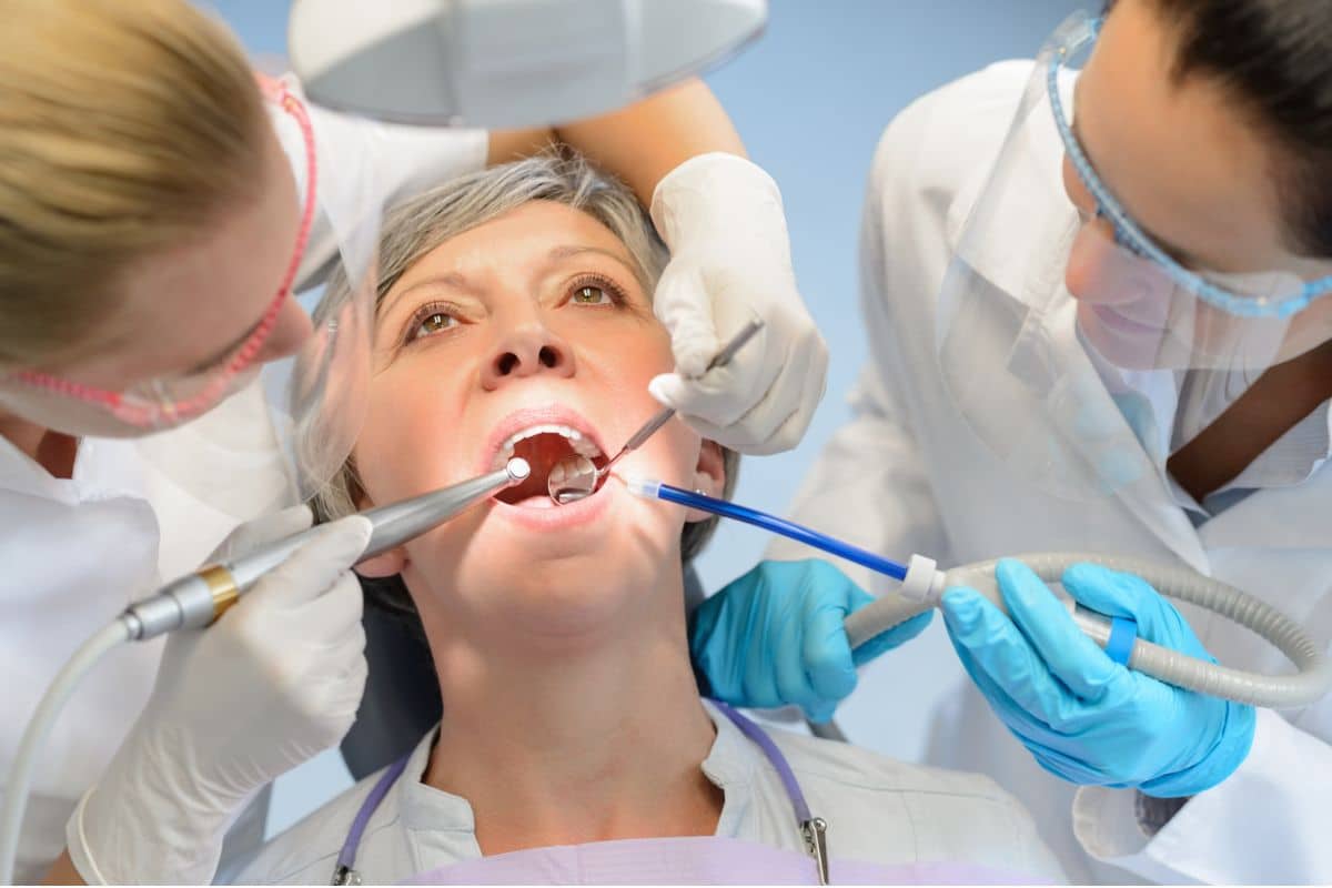 Dental team preparing a patient for sedation 